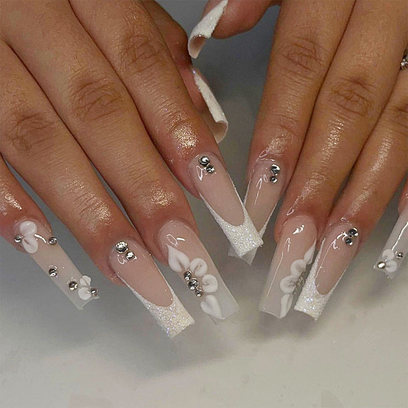 Glamorous stiletto artificial nails with floral details Stornfield