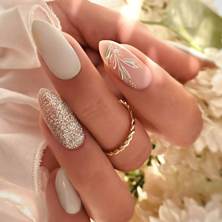 Artificial nail creation with glamorous tips and glitter details Stornfield
