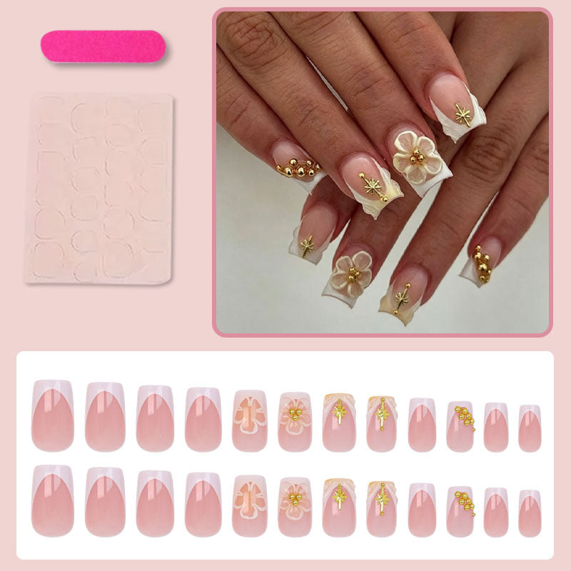 Nail set with delicate flower and gold embellishments Stornfield