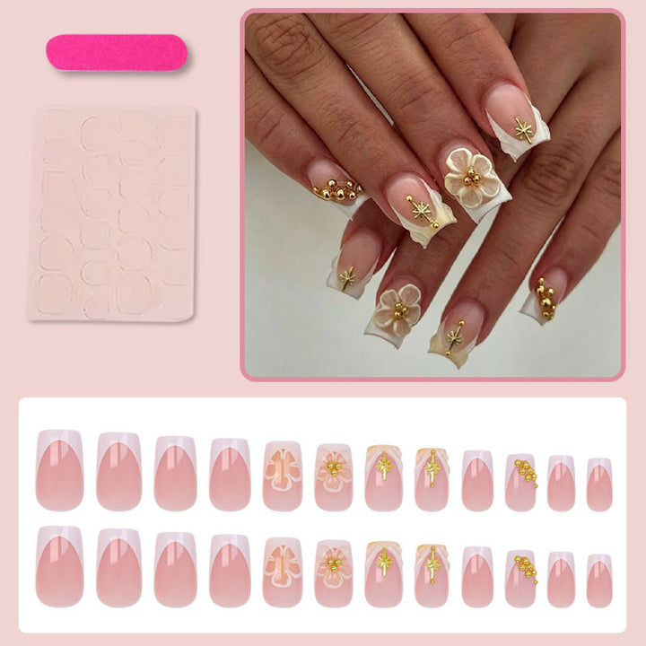 Nail set with delicate flower and gold embellishments Stornfield