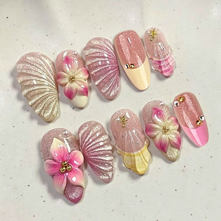 Artificial nail set with elaborate flower and shell patterns Stornfield