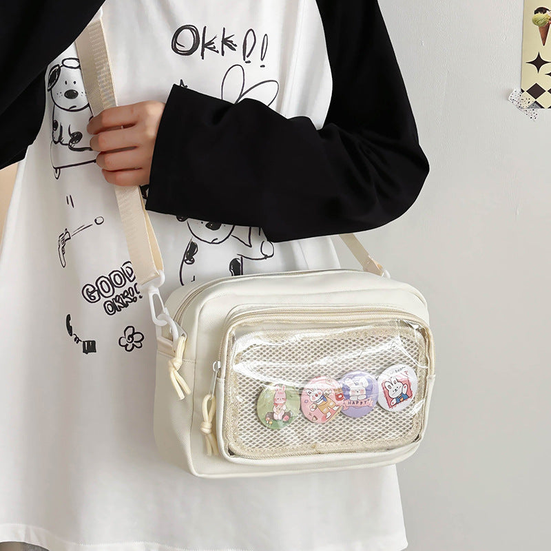 Shoulder bag with transparent viewing pocket and playful graphic design Stornfield