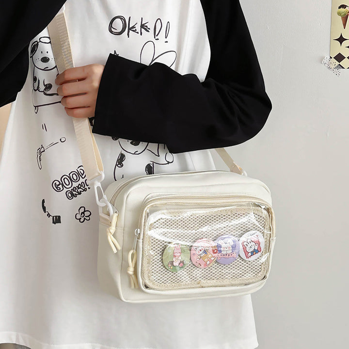 Shoulder bag with transparent viewing pocket and playful graphic design Stornfield