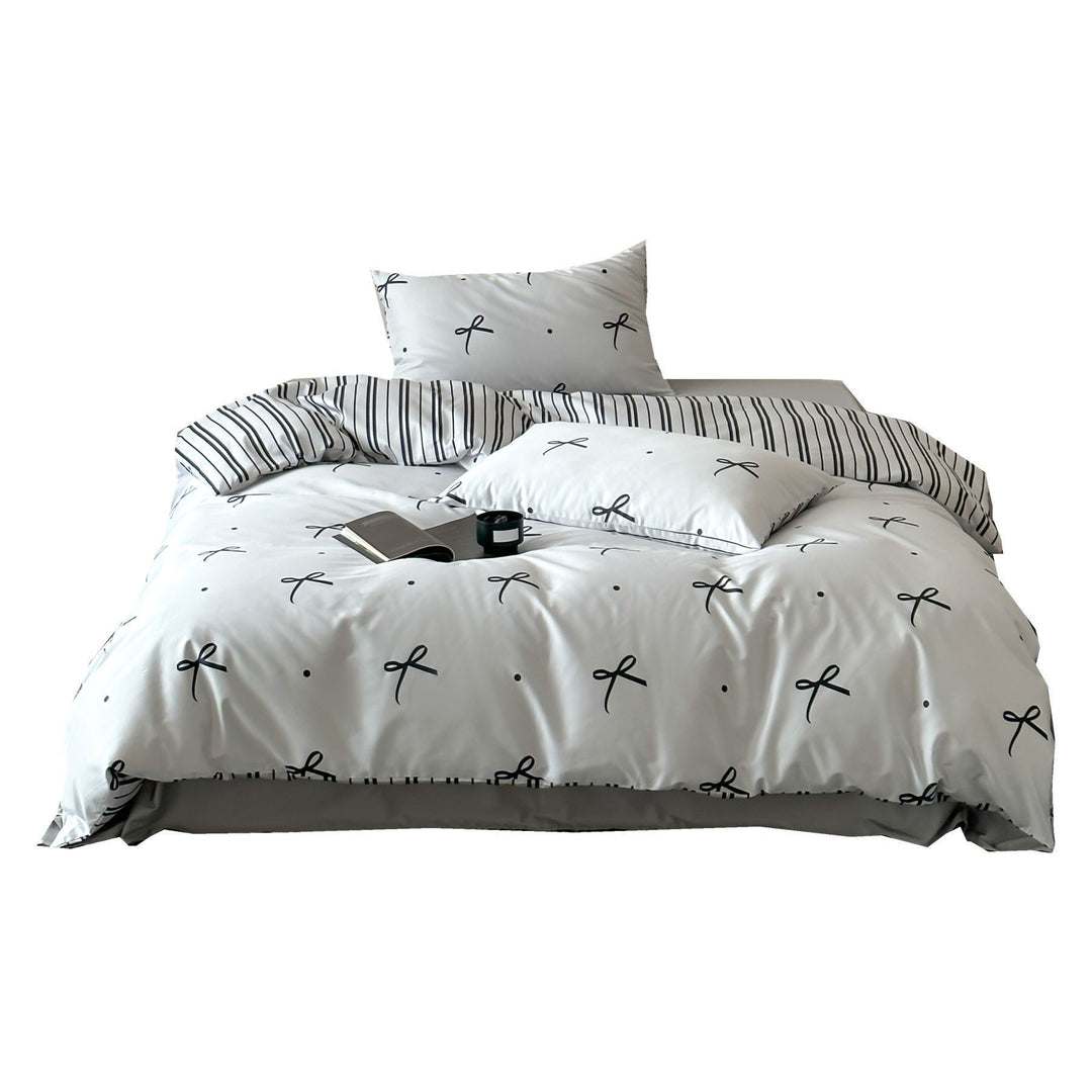 Modern cotton bedding set with minimal bow print and striped reversible side