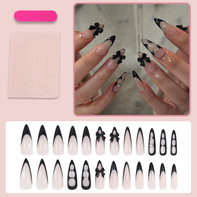 Acrylic nail set with shimmering accents and elegant bows Stornfield