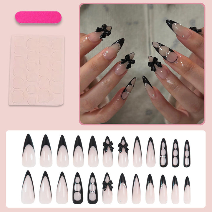 Acrylic nail set with shimmering accents and elegant bows Stornfield