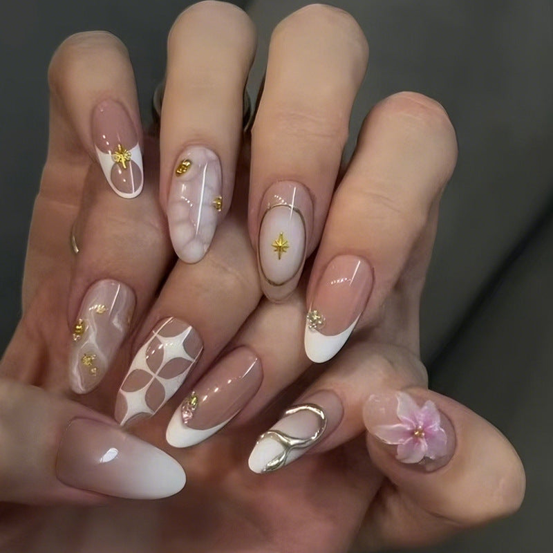 Acrylic nail set with romantic flowers and elegant design elements Stornfield