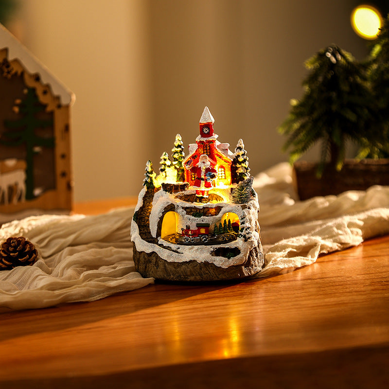 Illuminated Christmas village scene with snowman Stornfield