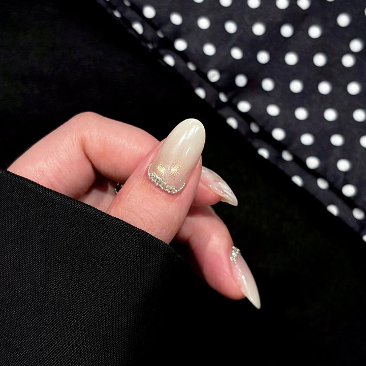 Artificial nails with shimmering accents and elegant applications Stornfield