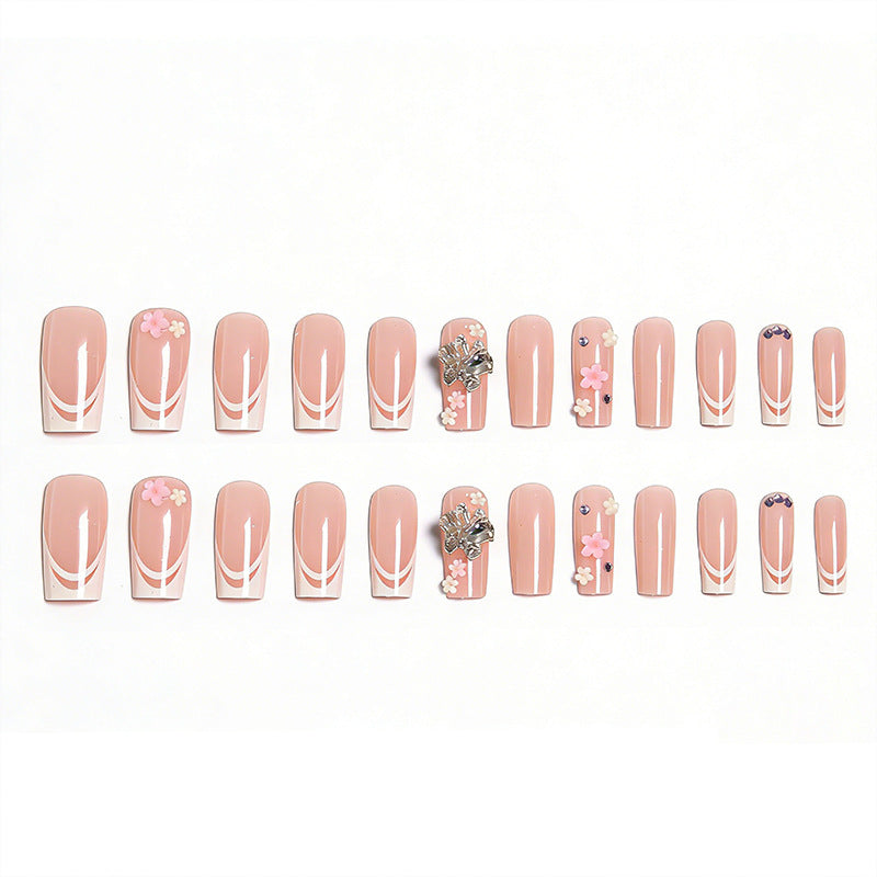 Artificial nails with floral accents and glitter effects Stornfield