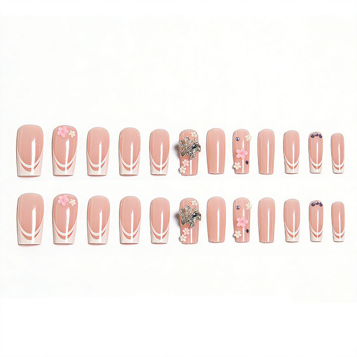 Artificial nails with floral accents and glitter effects Stornfield