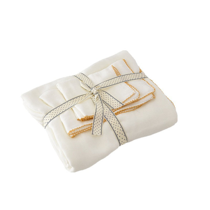 Baby cuddle cloth made of double-layered cotton muslin with fine decorative lace