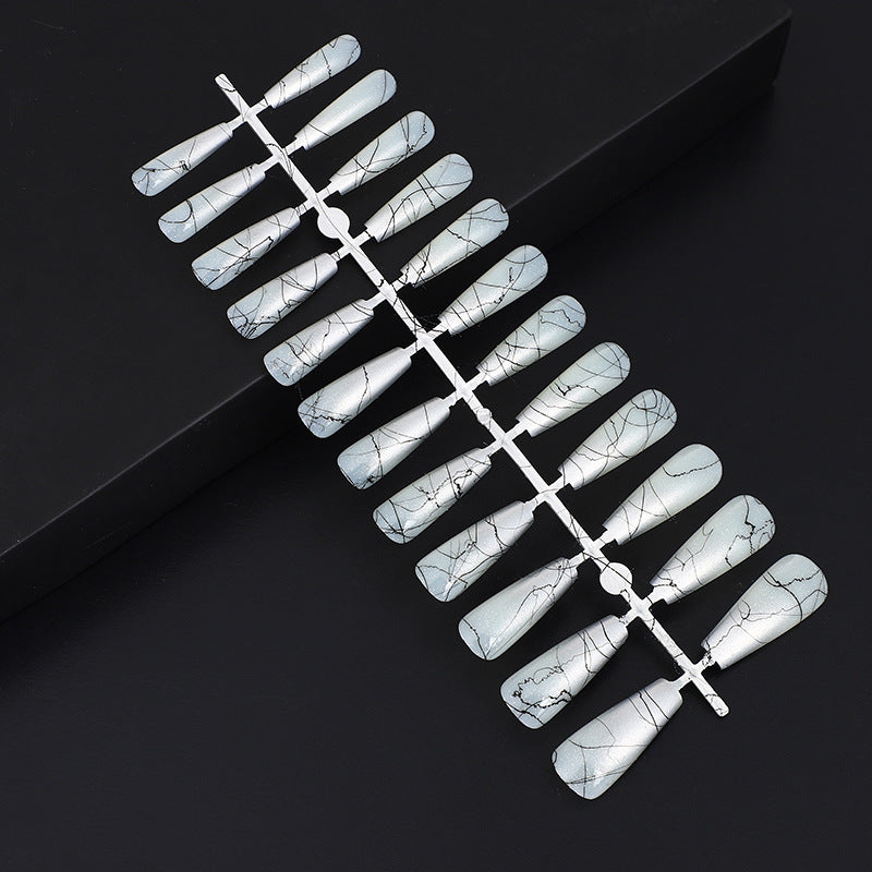 Artificial nails in modern ombre design with marbled accents Stornfield