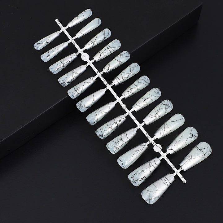 Artificial nails in modern ombre design with marbled accents Stornfield
