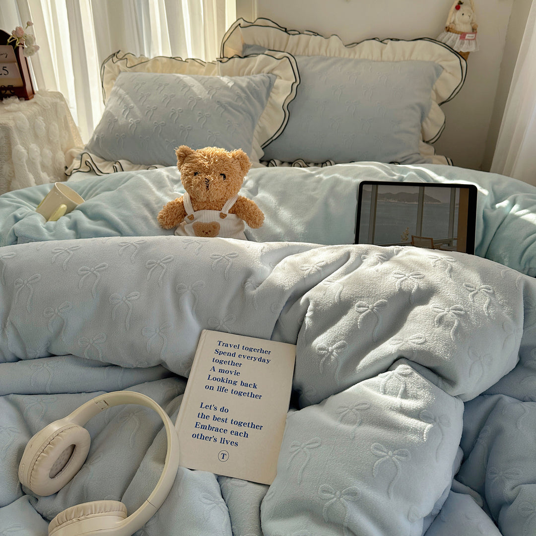 Cozy quilted bedding set with relief ribbon embroidery and contrasting ruffle edge