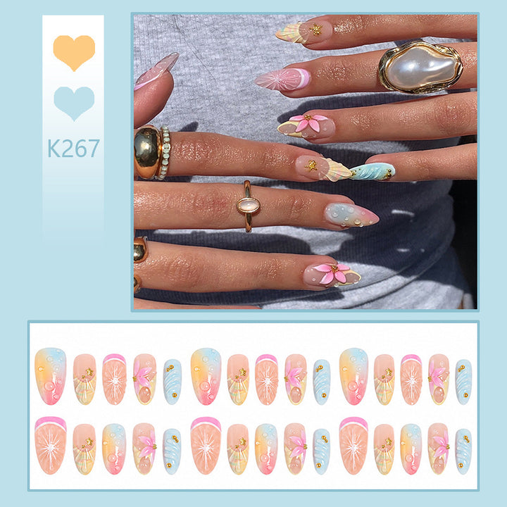 Artificial nails with creative flower and glitter detail Stornfield