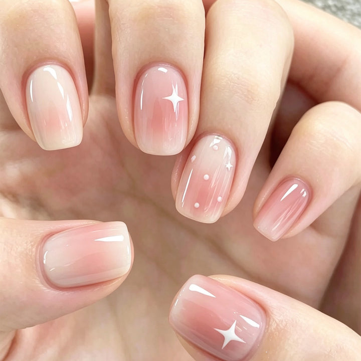 Nail art with ombre effect and glitter accents Stornfield