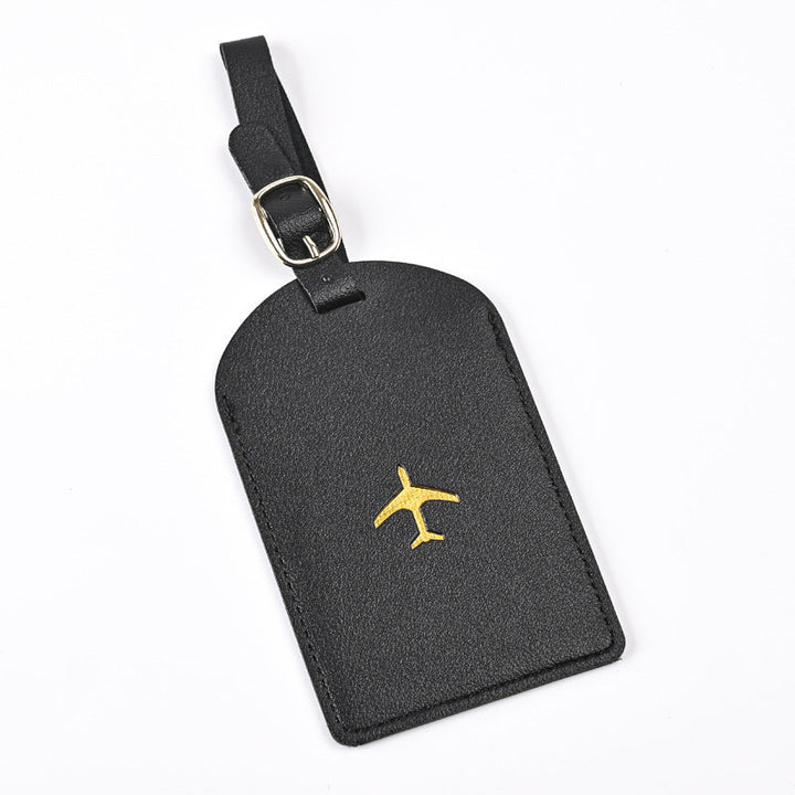 premium leather luggage tag with adjustable buckle strap and embossed airplane Stornfield
