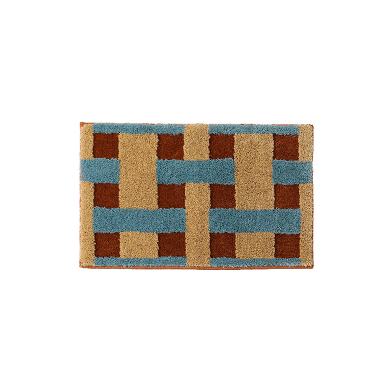 Rectangular tufted door mat with geometric block pattern and non-slip backing Stornfield