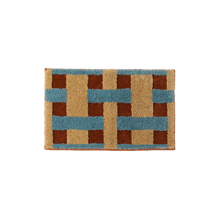 Rectangular tufted door mat with geometric block pattern and non-slip backing Stornfield