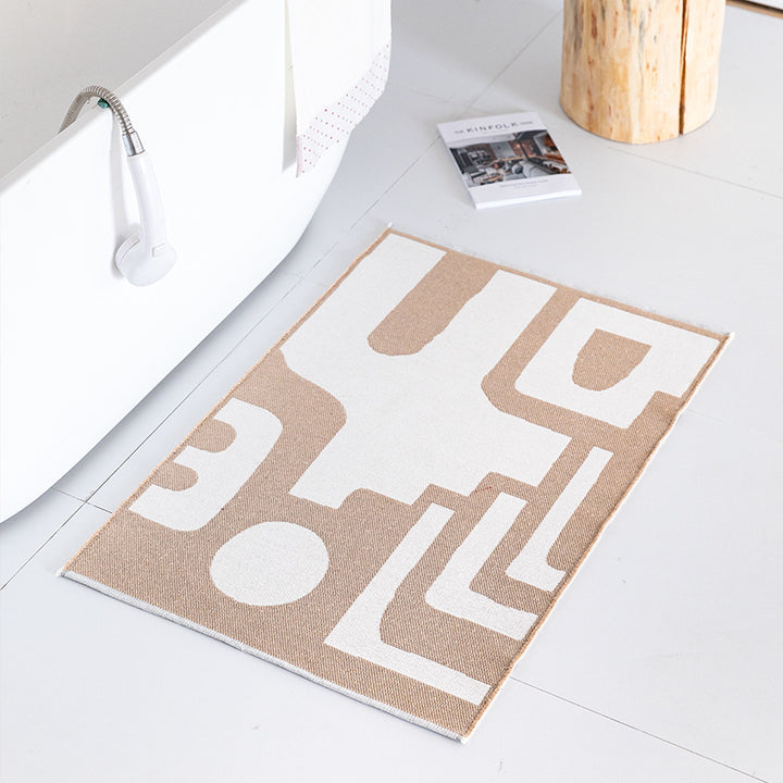 Flat-woven bath mat with abstract geometric pattern Stornfield
