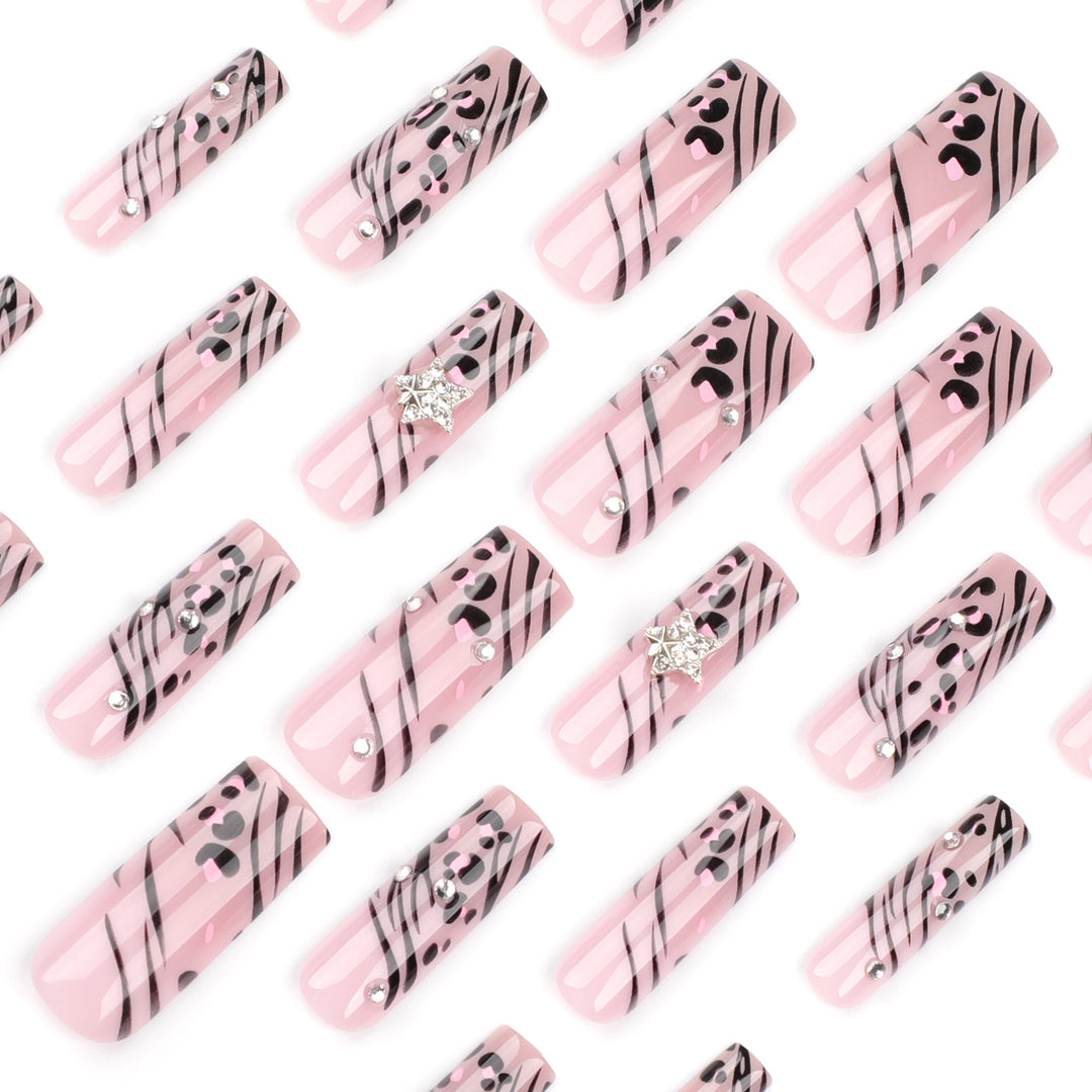 Artful Nail Art with Zebra Pattern and Glitter Accents Stornfield