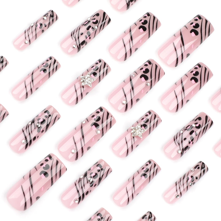 Artful Nail Art with Zebra Pattern and Glitter Accents Stornfield