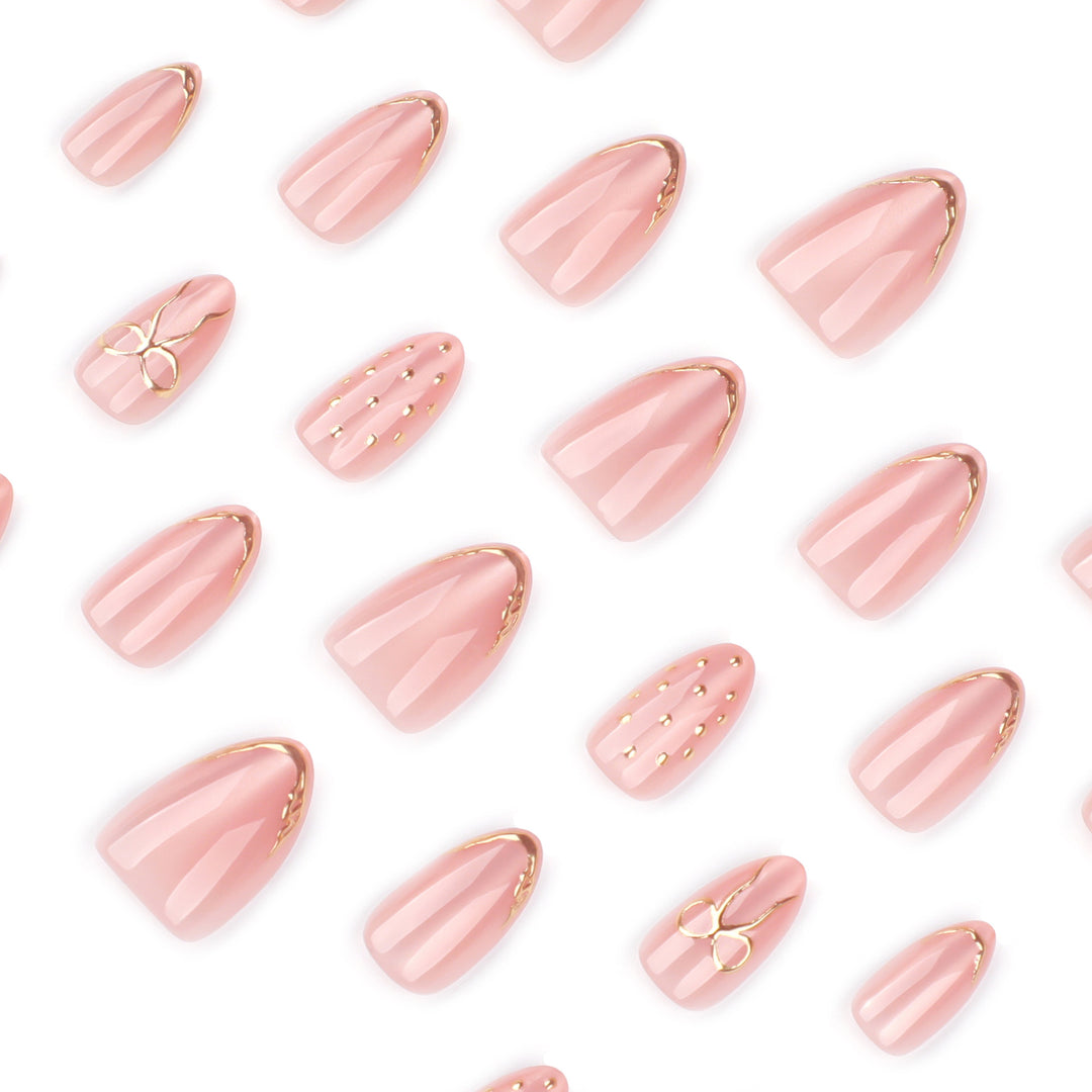 Artful nail extensions with elegant golden accents Stornfield