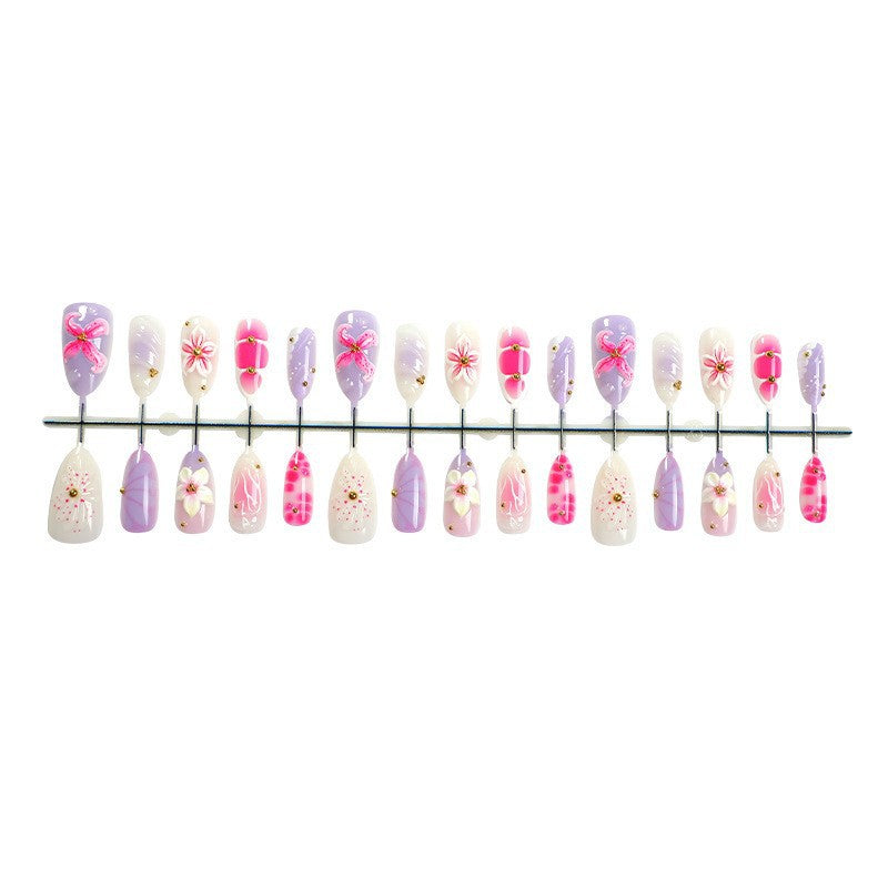 Acrylic nail set with elegant floral design and 3D accents Stornfield