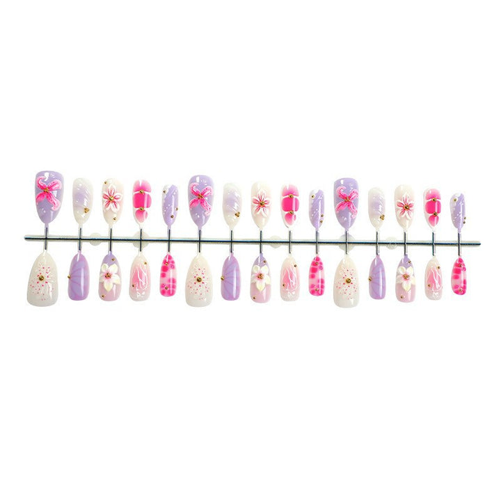 Acrylic nail set with elegant floral design and 3D accents Stornfield
