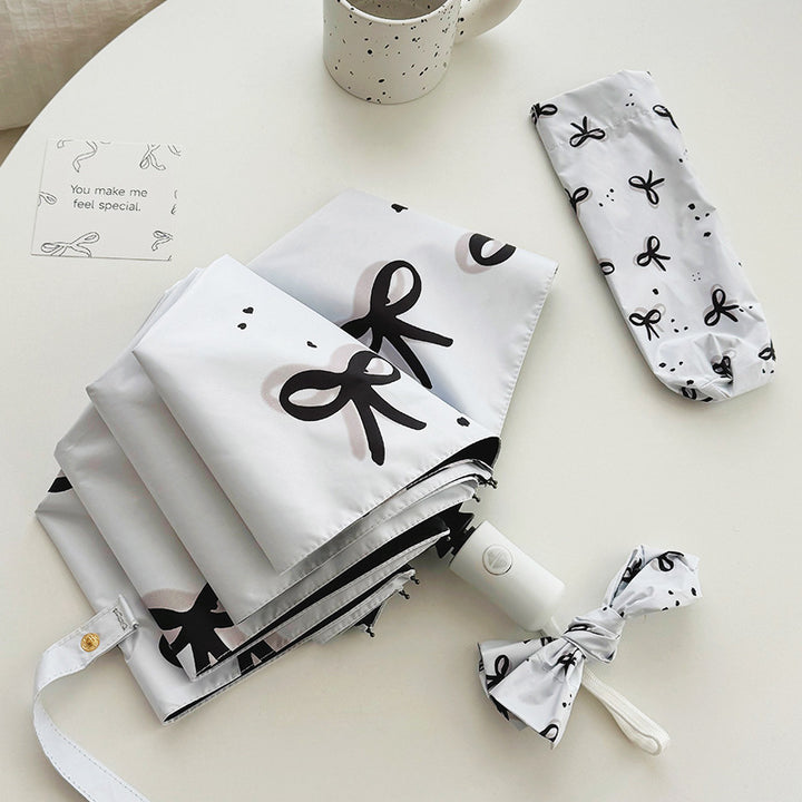 Women’s Folding Umbrella with Playful Bow Pattern Stornfield
