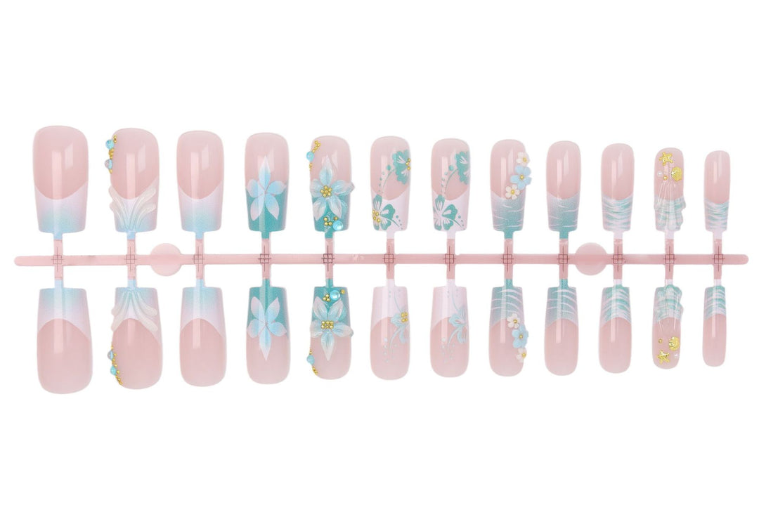 Acrylic nail set with elegant floral decorations and glitter accents Stornfield