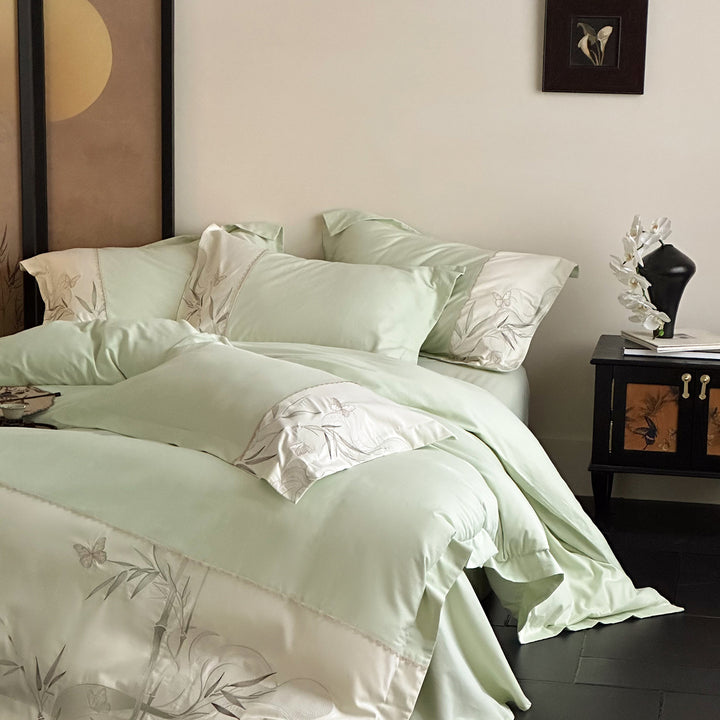 Elegant cotton satin bedding set with embroidered bamboo and butterfly border