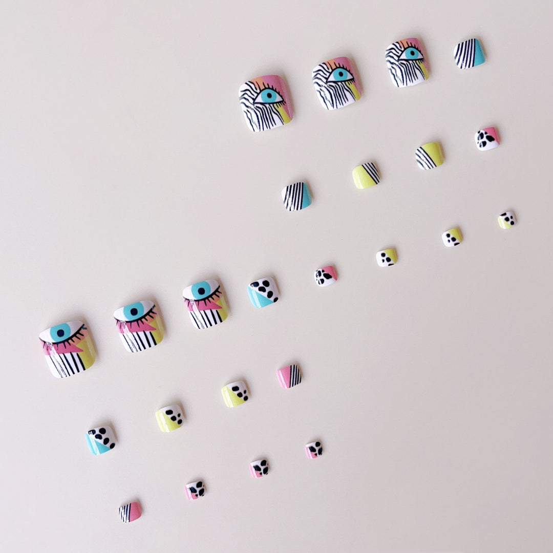 Artificial nail set with vibrant color accents and geometric patterns Stornfield