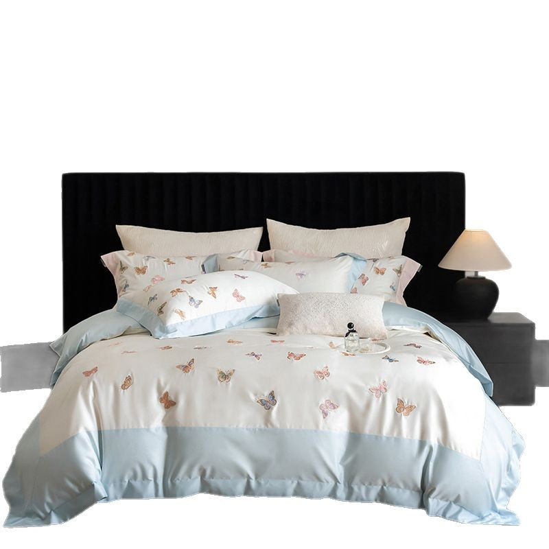 Luxurious cotton satin bedding set with embroidered butterfly appliqués