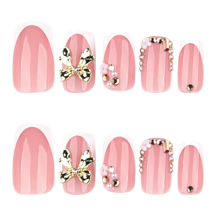 Elegant Nail Extensions with French Tips and Decorative Accents Stornfield