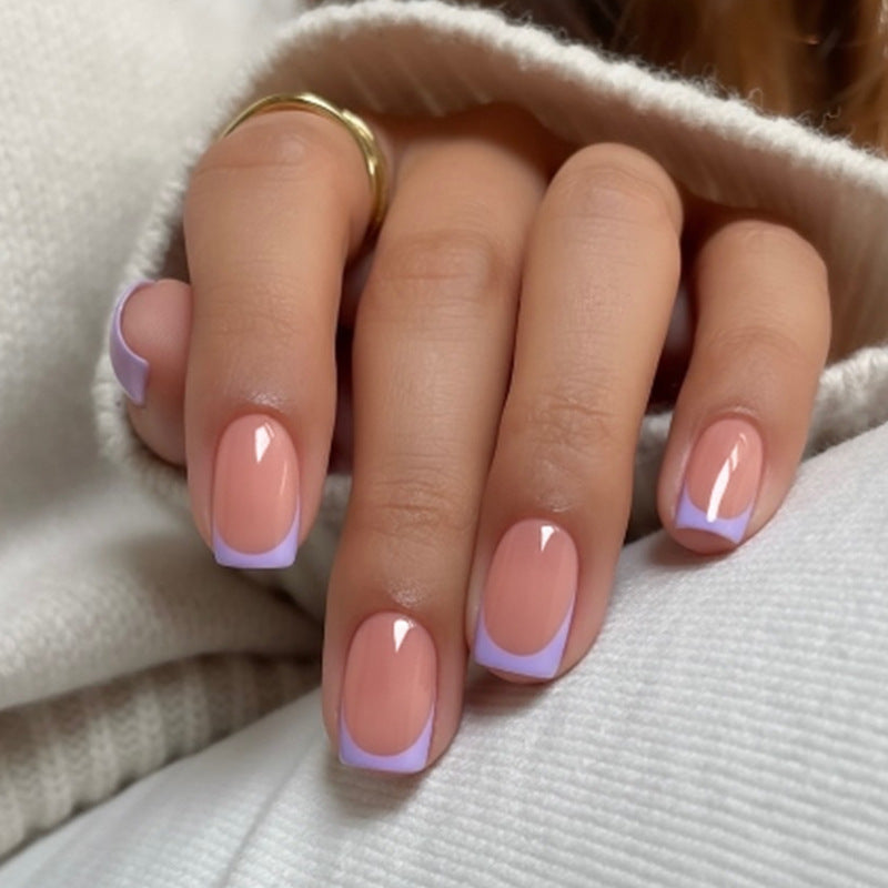 Artificial nail set with elegant French manicure style and romantic accents Stornfield