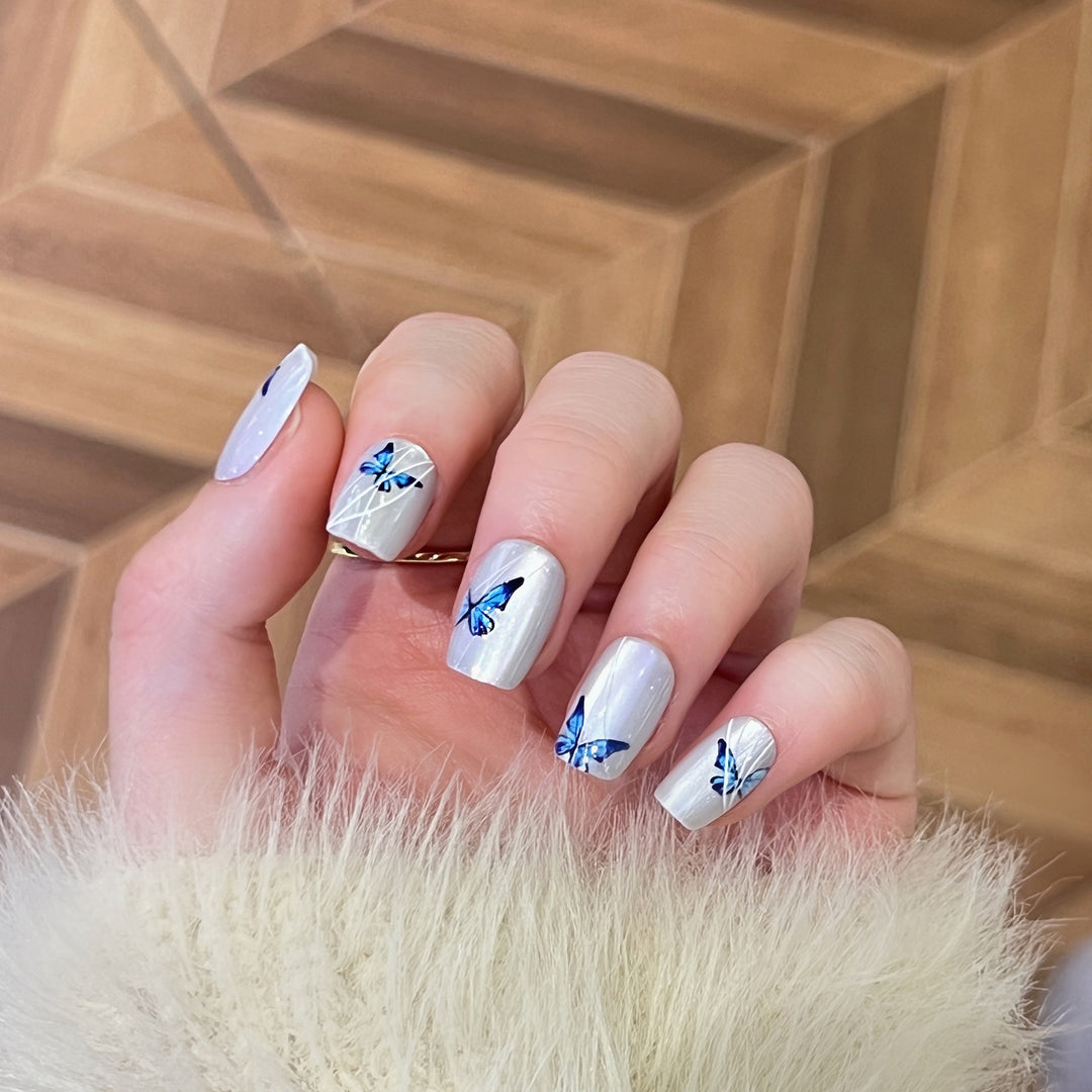 Creative nail extensions with intricate butterfly design Stornfield