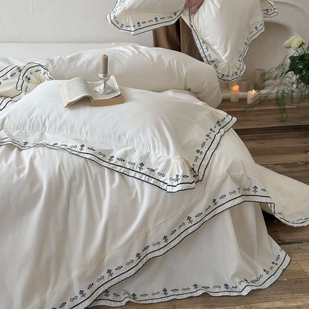 Luxurious embroidered bedding set with ruffled hem