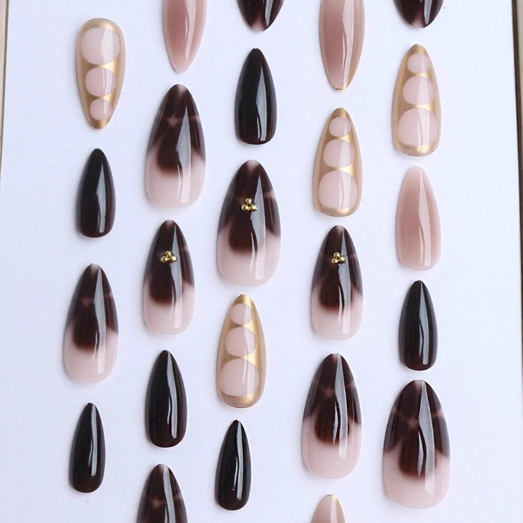 Artificial nail set with elegant ombre design and gold embellishments Stornfield
