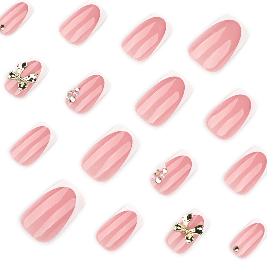 Elegant Nail Extensions with French Tips and Decorative Accents Stornfield