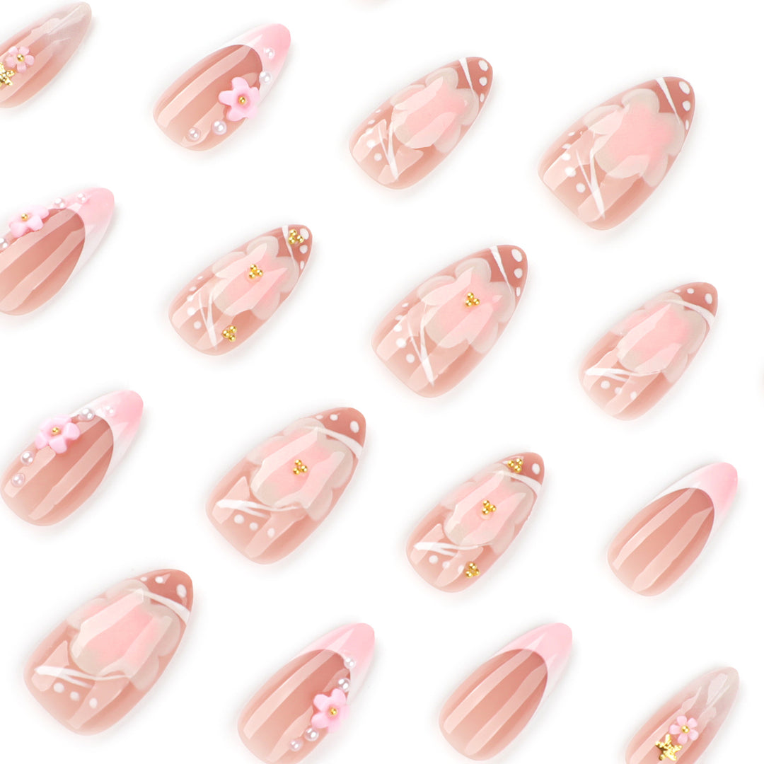 Artful nail extensions with floral patterns and glitter accents Stornfield