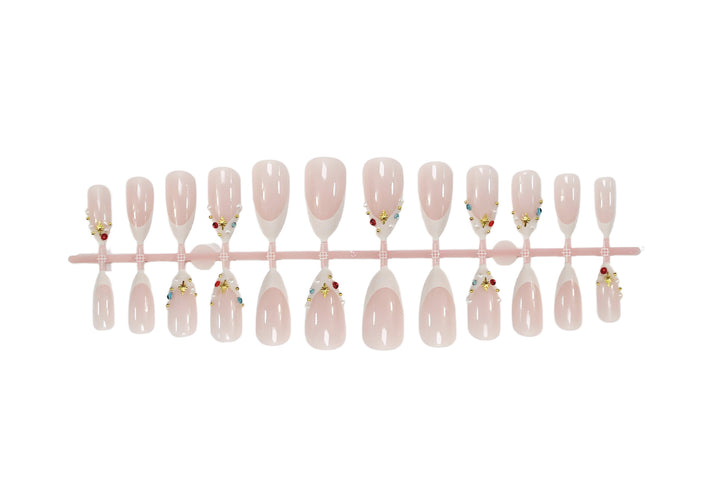 Acrylic nail set with glamorous embellishments and elegant accents Stornfield