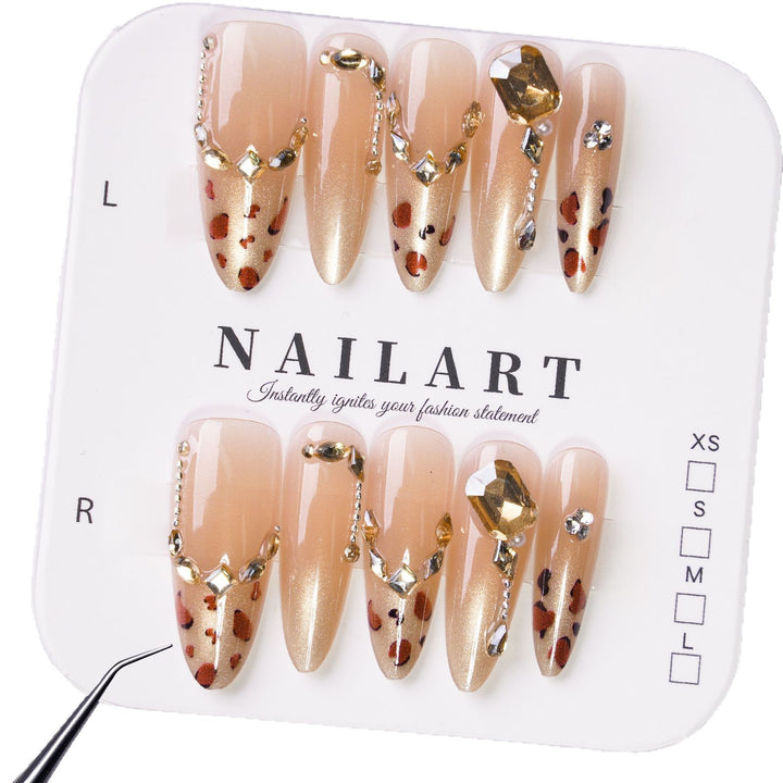 Glamorous artificial nails with elegant glitter accents and leopard details Stornfield