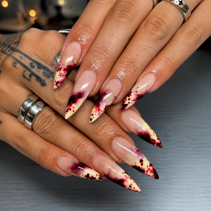 Acrylic nail set with bloody accents and elegant stiletto design Stornfield