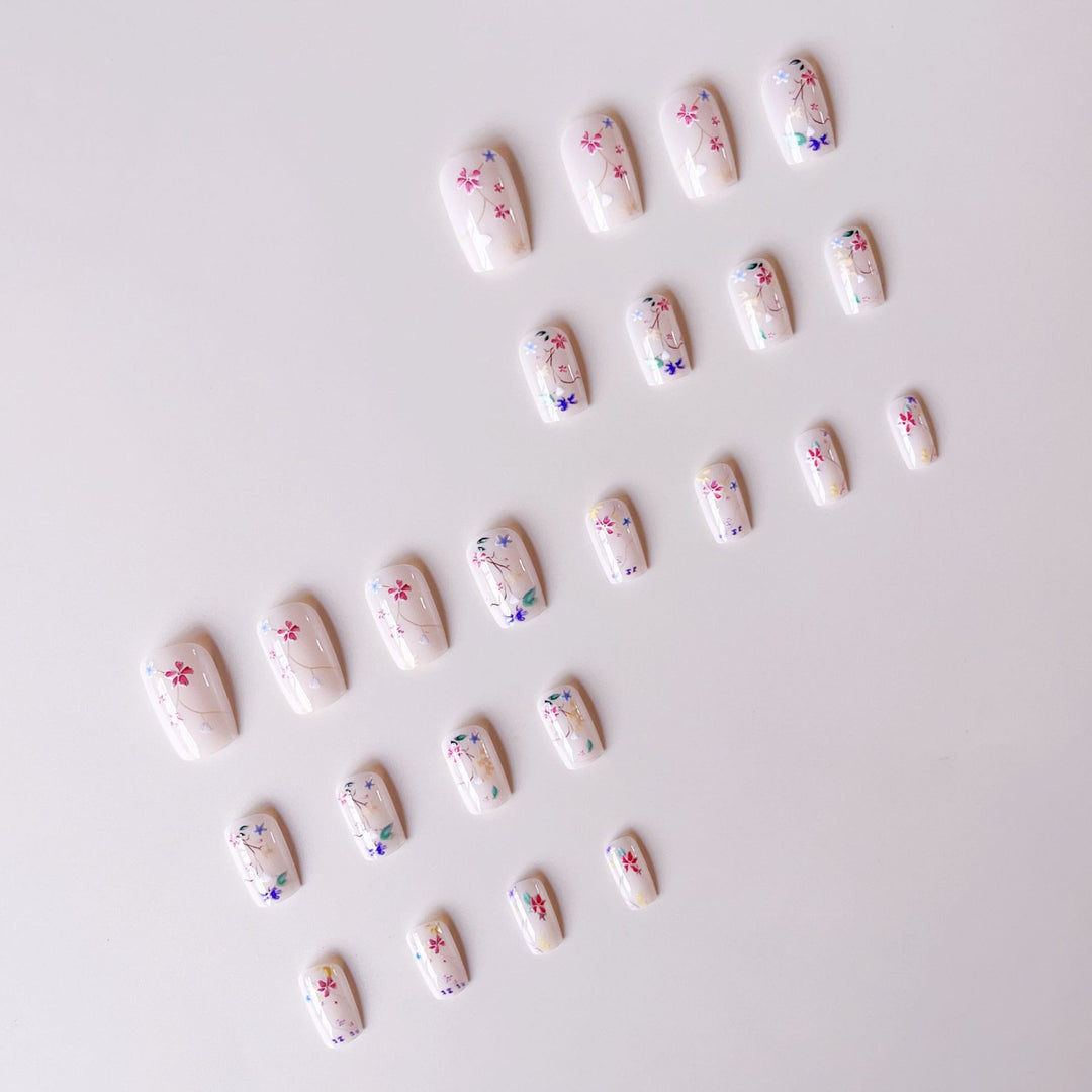 Nail set with floral accents and transparent shine Stornfield