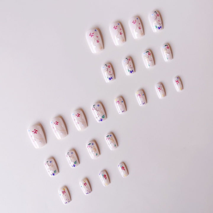 Nail set with floral accents and transparent shine Stornfield