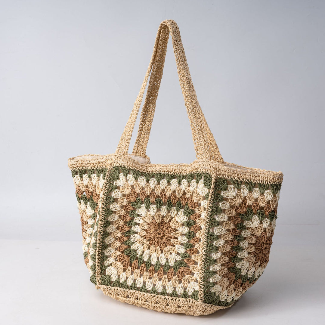 Beach bag made of hand-woven natural material with a square pattern Stornfield