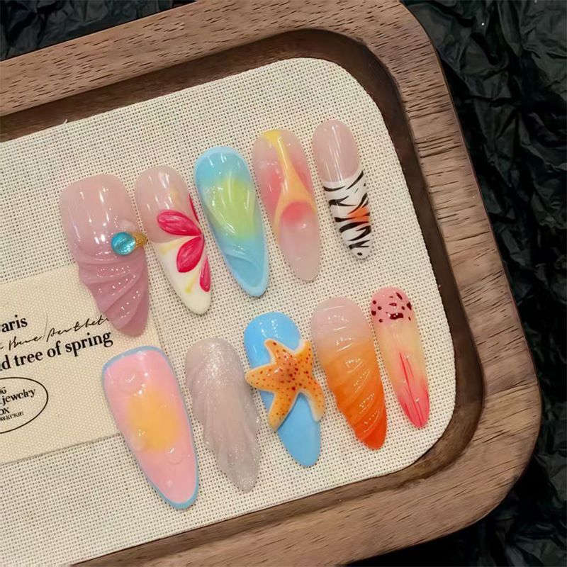 Nail art set with floral patterns and ombre effects Stornfield