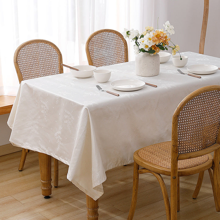 Rectangular premium table linen made of jacquard polyester with subtle frost floral embossing Stornfield
